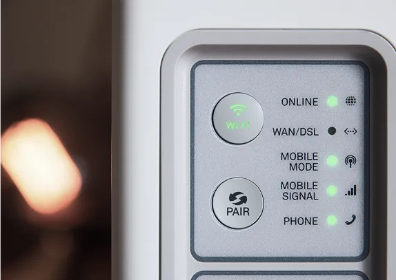 A modem with its status lights lit