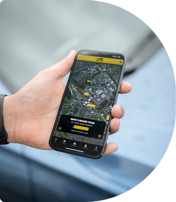 A hand holding a phone showing a tracking map
