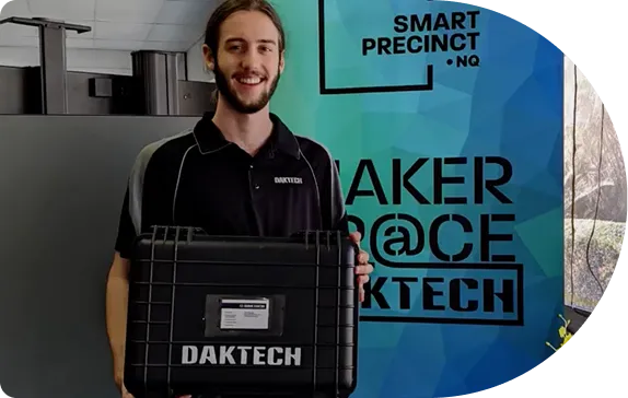 A team member holding a DakTech equipment case in the Maker Space