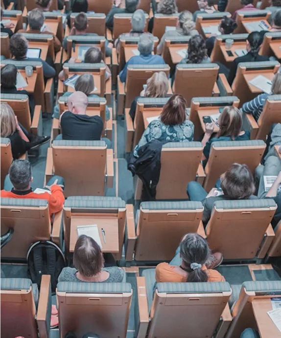 Students seated in a university lecture theatre