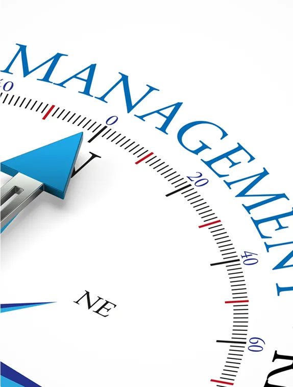 A compass needle pointing at the word Management