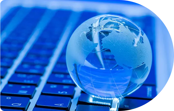 A glass globe on a keyboard