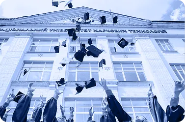 Graduates throwing their caps in the air